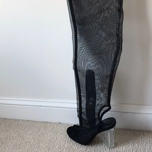 Thigh-high black netted boots